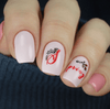 Pale-pink-manicure-with-the-words-spring-in-nail-art