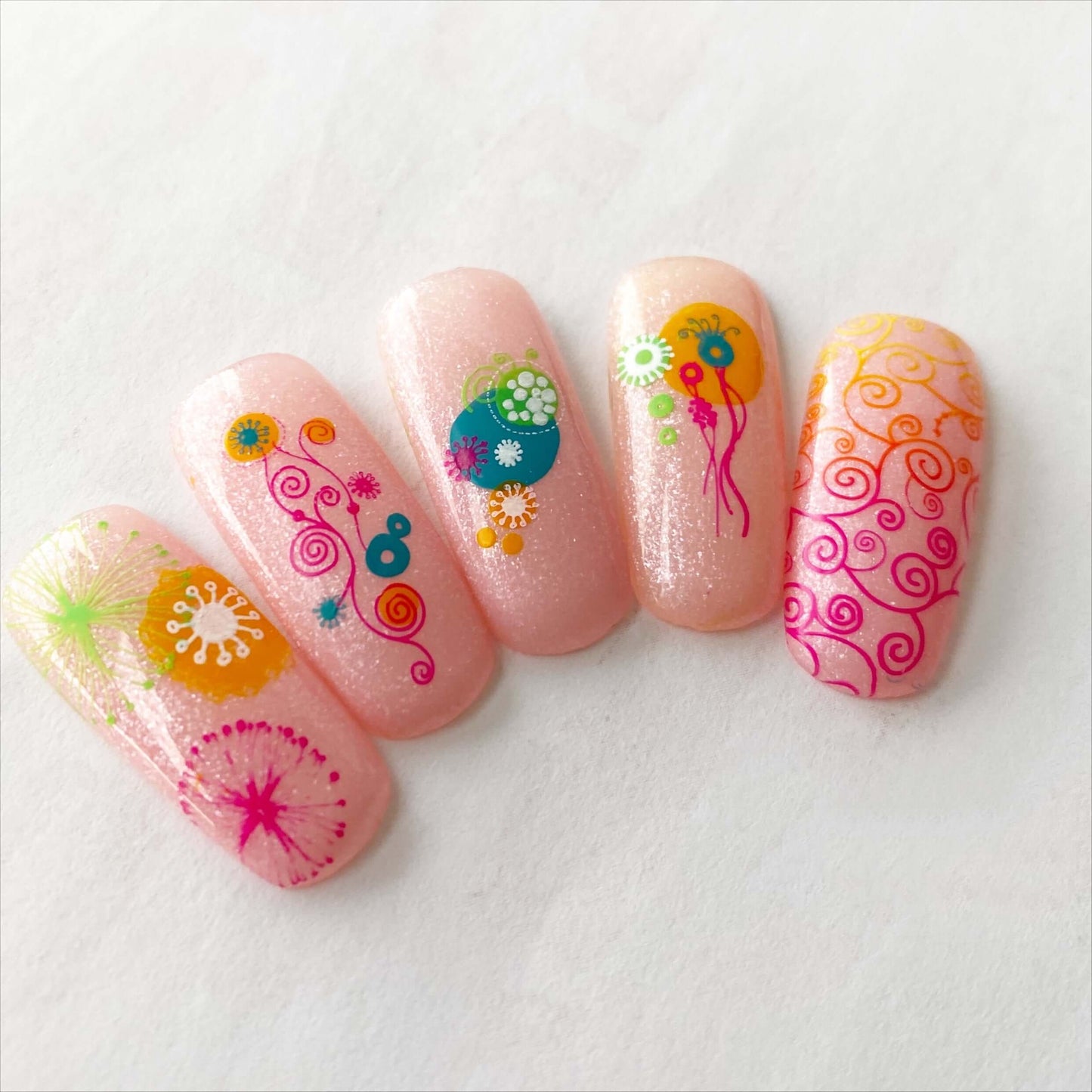 beautiful-set-of-nail-tips-with-stunning-nail-art-designs-of-swirls-twirls-and-abstract-shapes