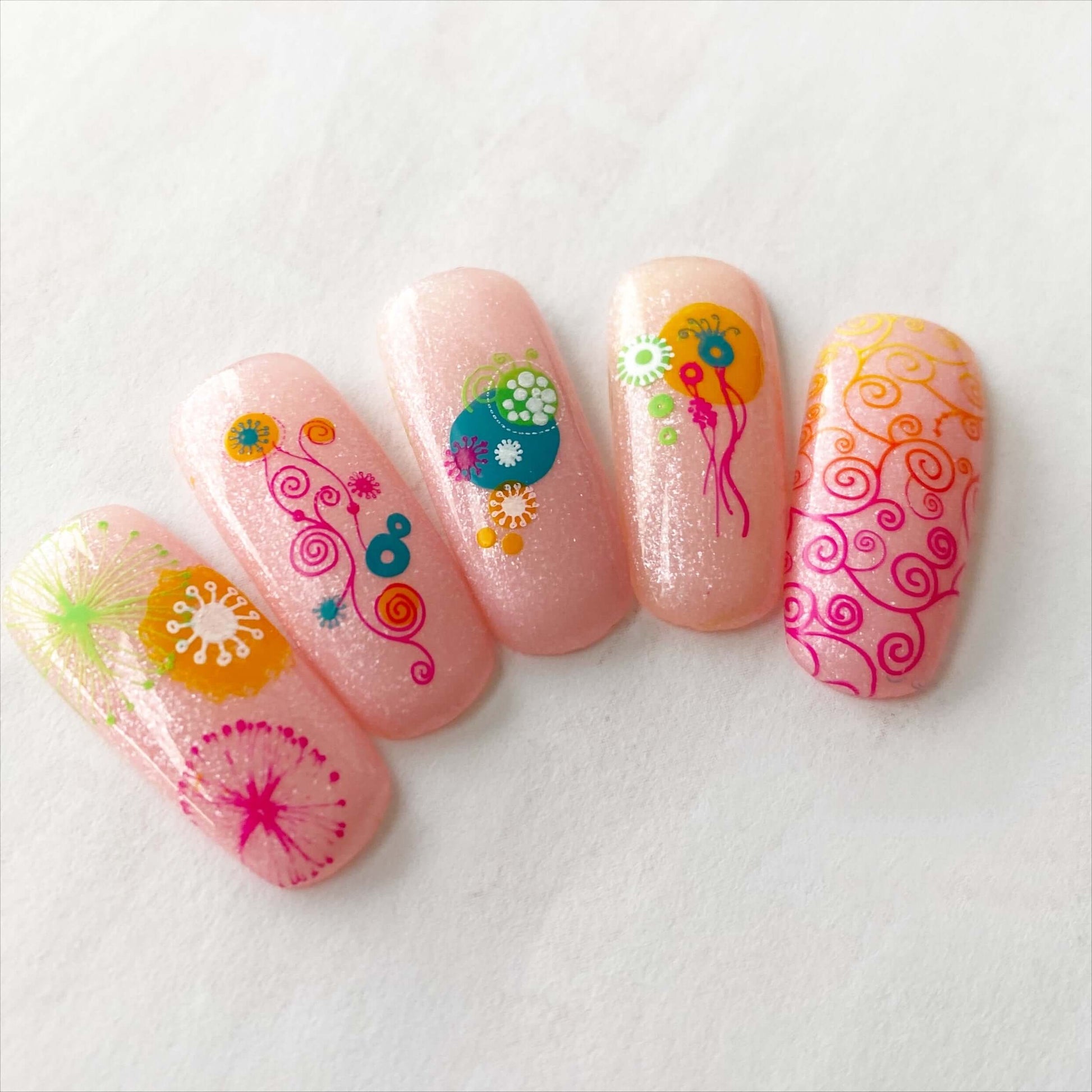 beautiful-set-of-nail-tips-with-stunning-nail-art-designs-of-swirls-twirls-and-abstract-shapes