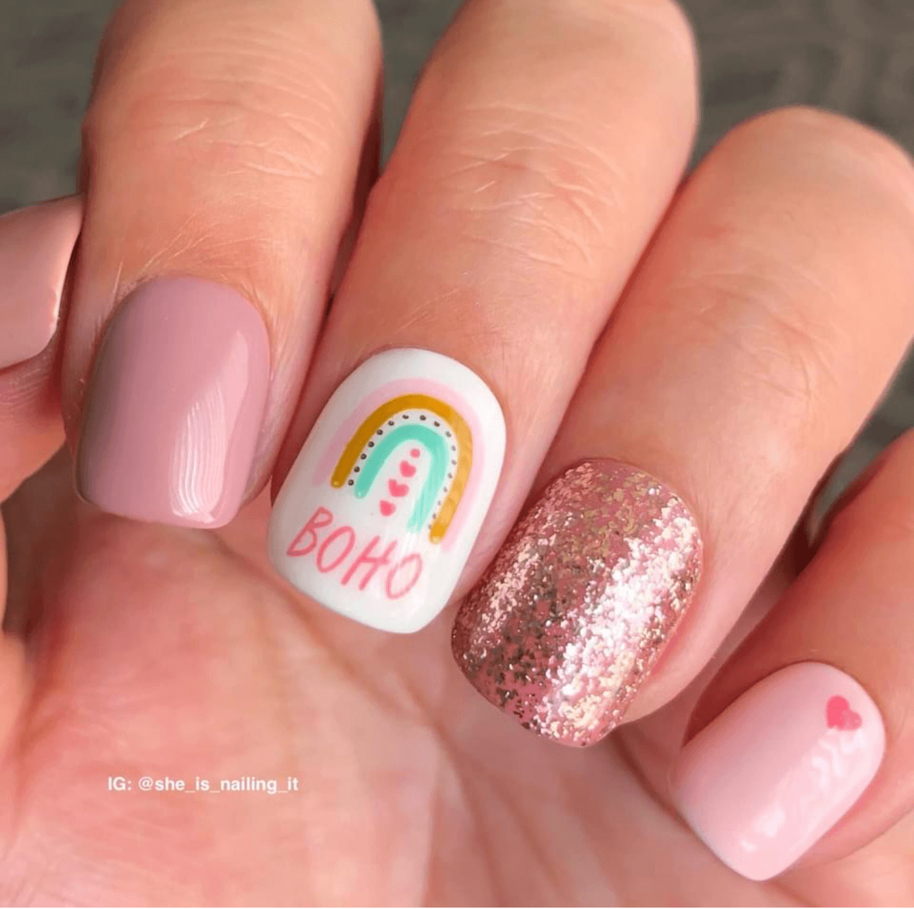 sparkly-manicure-with-a-nail-art-design-of-arches-and-hearts-with-the-words-boho