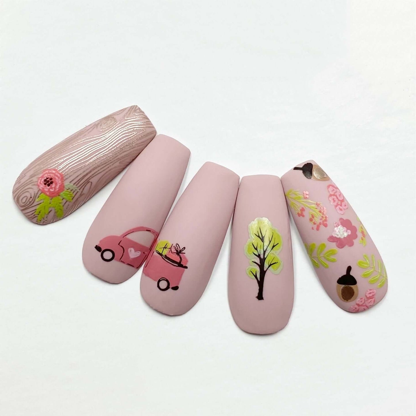 set-of-nail-tips-with-lstunning-ayered-nail-art-designs-of-a-truck-trees-and-leaves