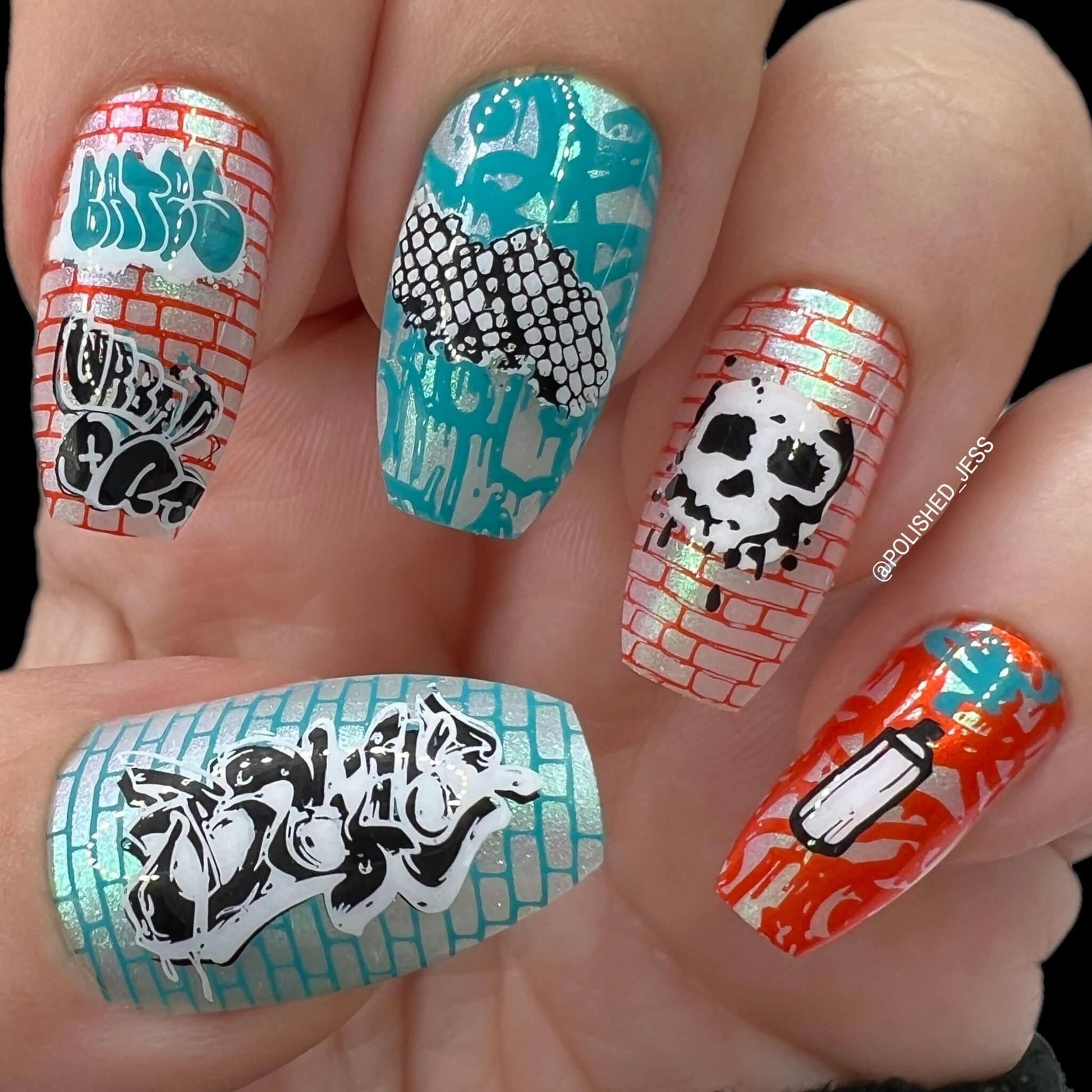 stunning-bright-manicure-with-graffiti-style-nail-art-designs-of-spray-paint-skull-and-tags