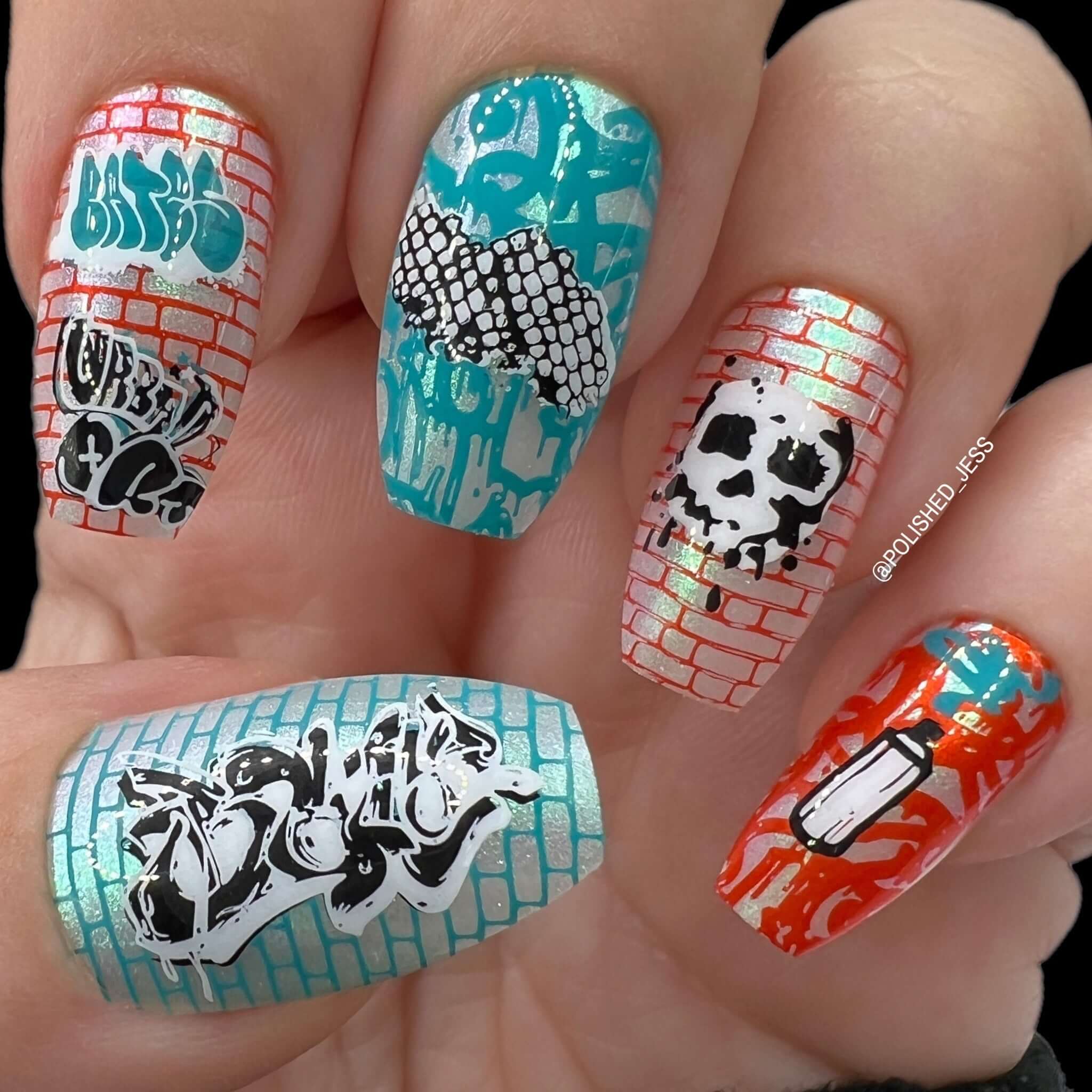 stunning-bright-manicure-with-graffiti-style-nail-art-designs-of-spray-paint-skull-and-tags