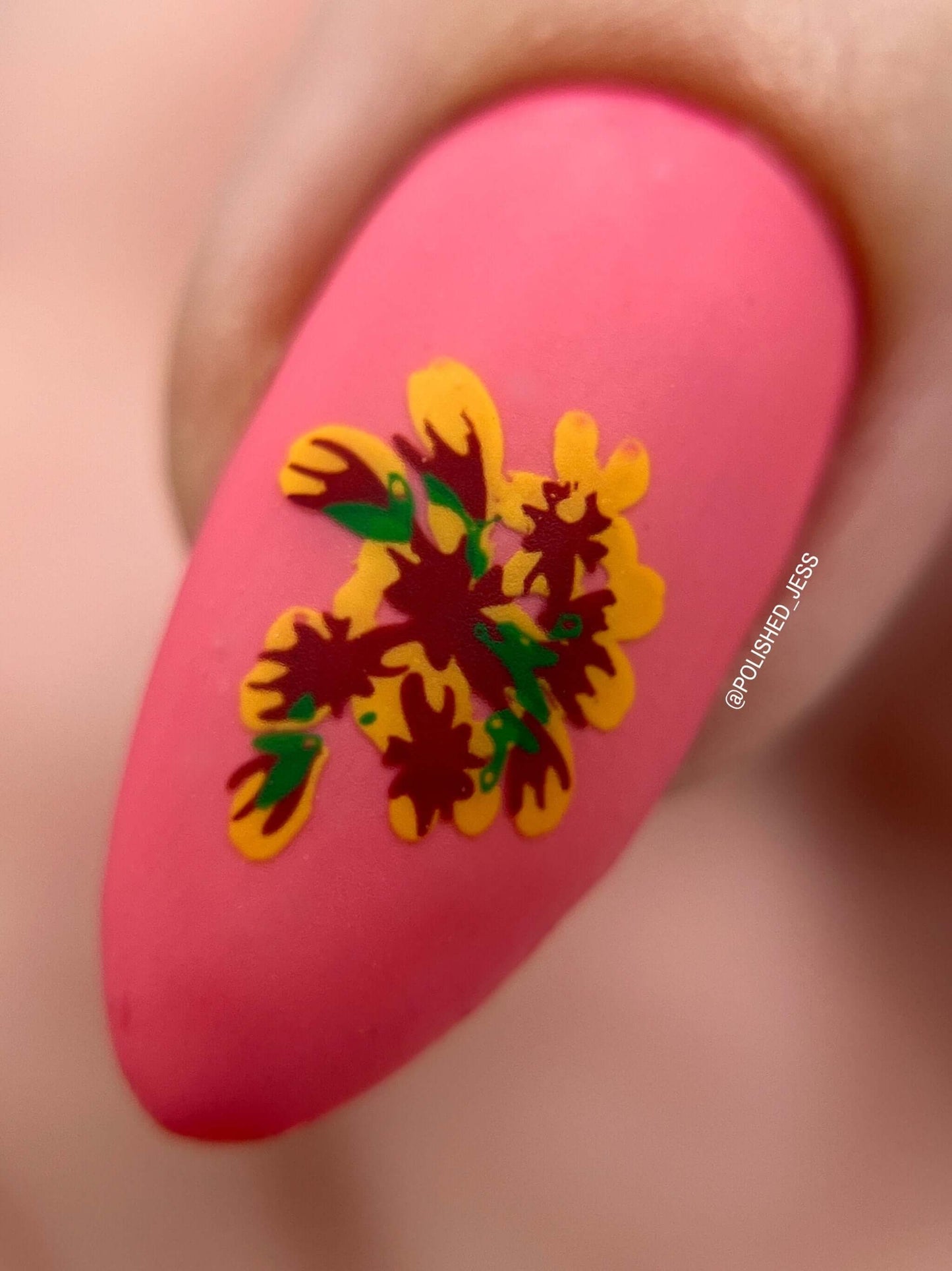 single-manicured-nail-showing-a-matte-layered-nail-art-design-of-a-flower