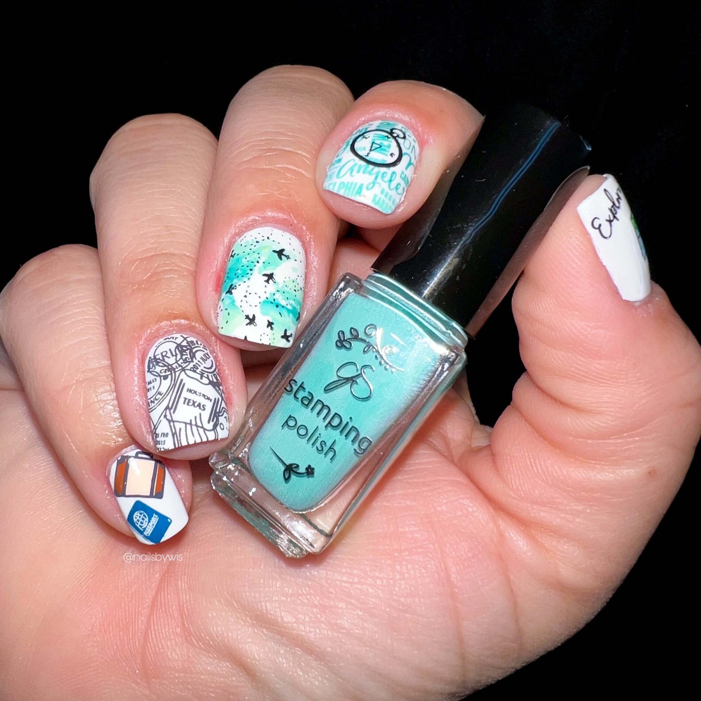 beautiful-manicure-showing-nail-art-designs-of-planes-passport-stamps-and-luggage