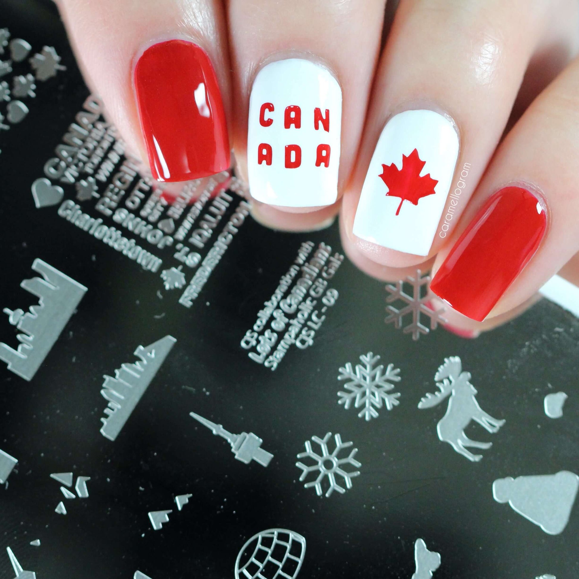 red-and-white-manicure-showing-a-nail-art-design-of-a-maple-leaf-and-the-words-canada