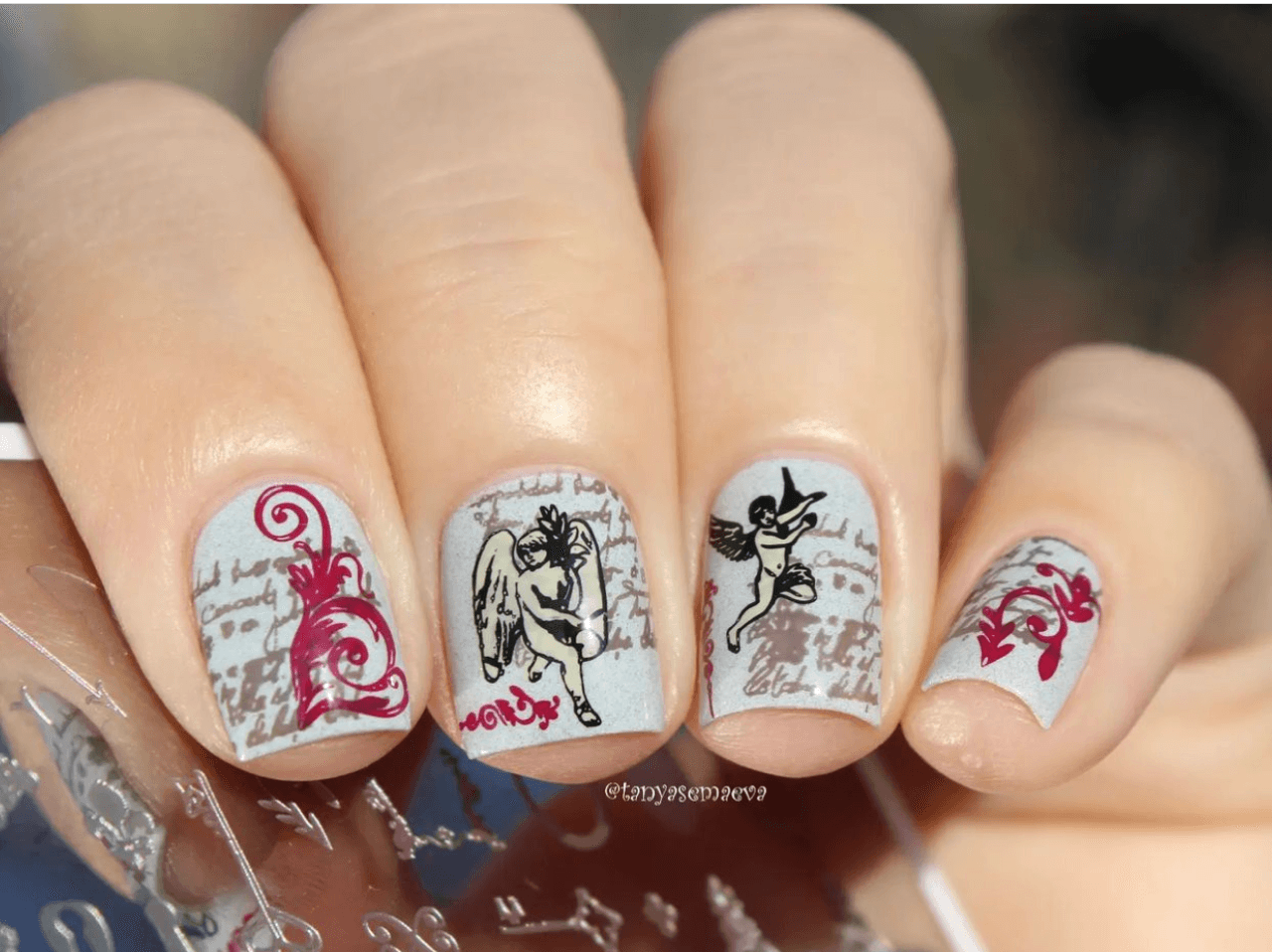stunning-manicure-with-vintage-nail-art-designs-of-chrubs-swirls-and-script