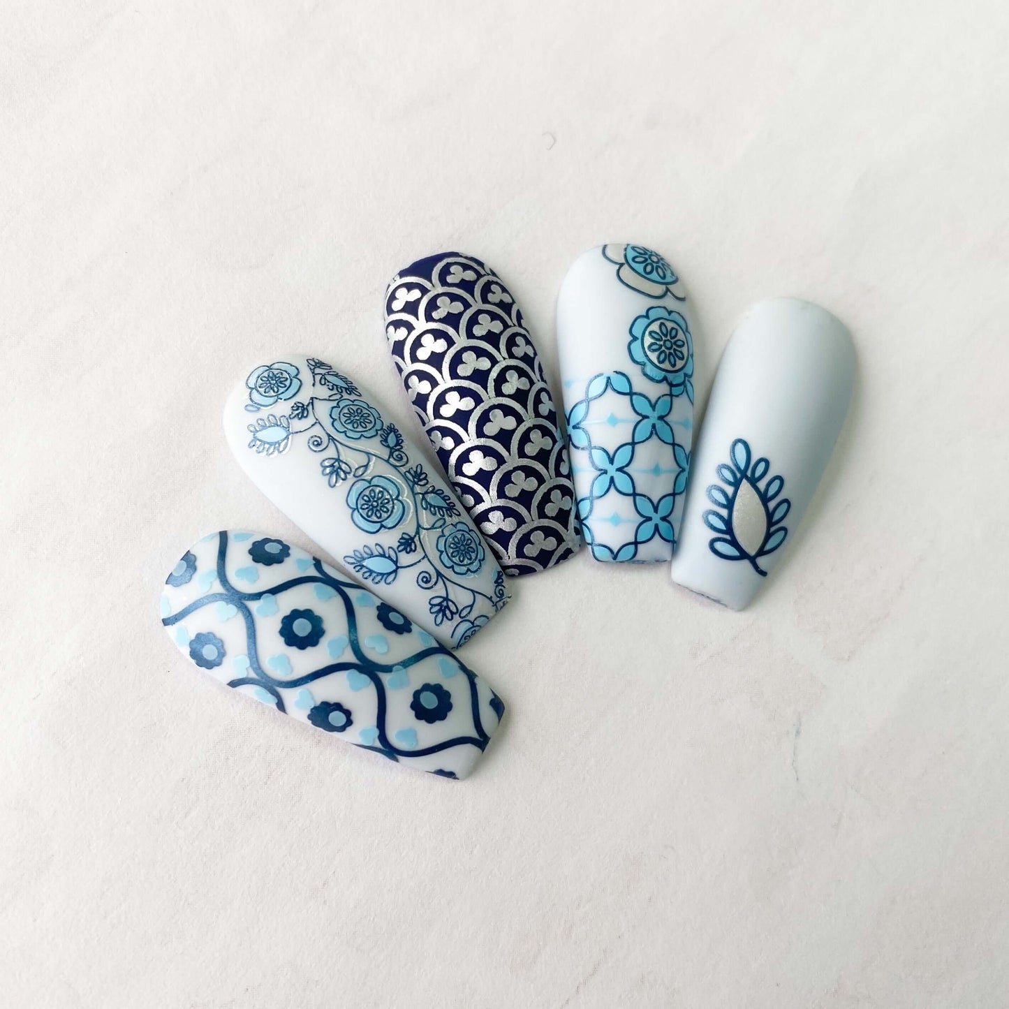 set-of-five-nail-tips-with-stunning-layered-nail-art-art-deco-and-floral-designs