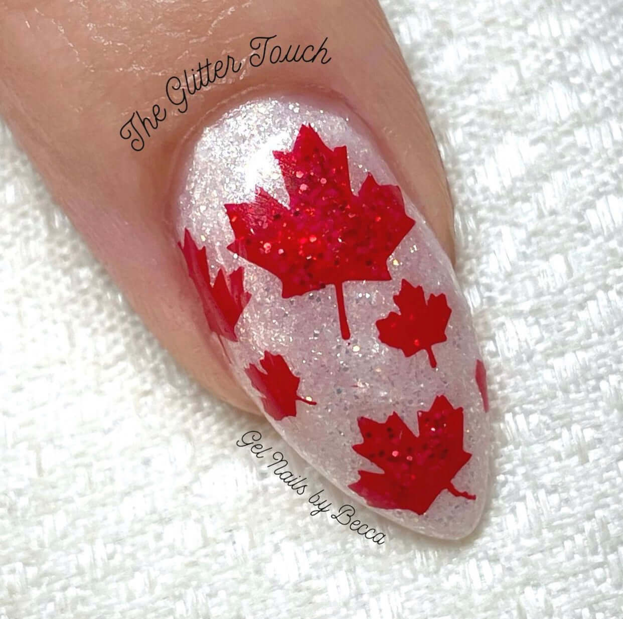 single-manicured-nail-with-full-coverage-maple-leaves-in-nail-art