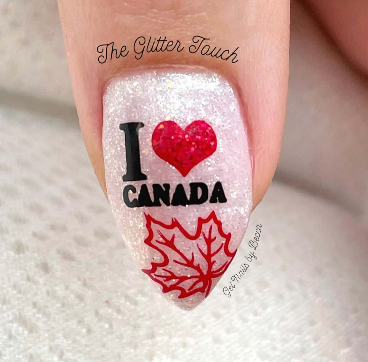 Glittery-white-single-manicured-nail-with-i-love-canada-in-nail-art