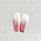two-nail-tips-showing-french-tip-designs-with-nail-art-swirls-on-in-pink-and-white