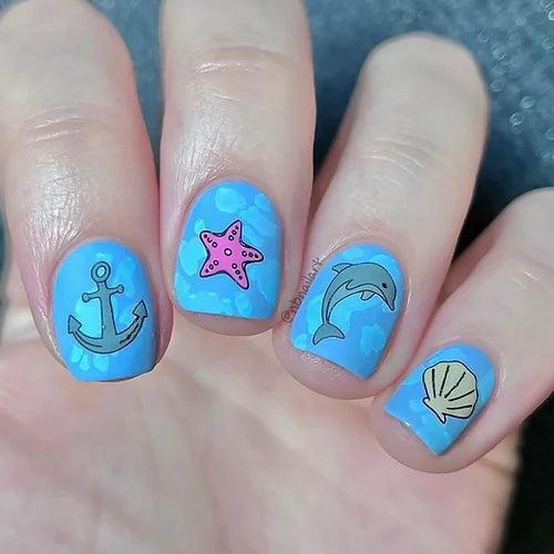 gorgeous-manciure-with-nail-art-designs-of-shells-dolphin-and-an-anchor