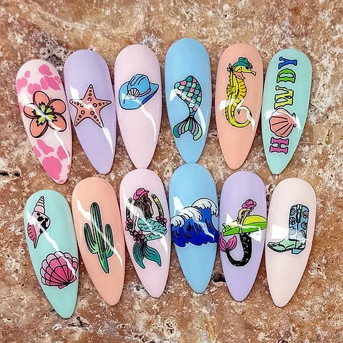 set-of-nail-tips-with-stunning-nail-art-designs-of-mermaid-tails-waves-and-seashells