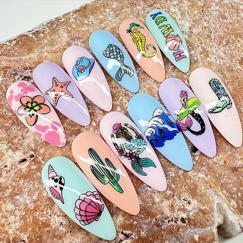 set-of-nail-tips-with-stunning-nail-art-designs-of-mermaid-tails-waves-and-seashells
