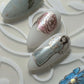 Four-manicured-nail-tips-showing-nail-art-designs-of-roses-flowers-holly-and-angel