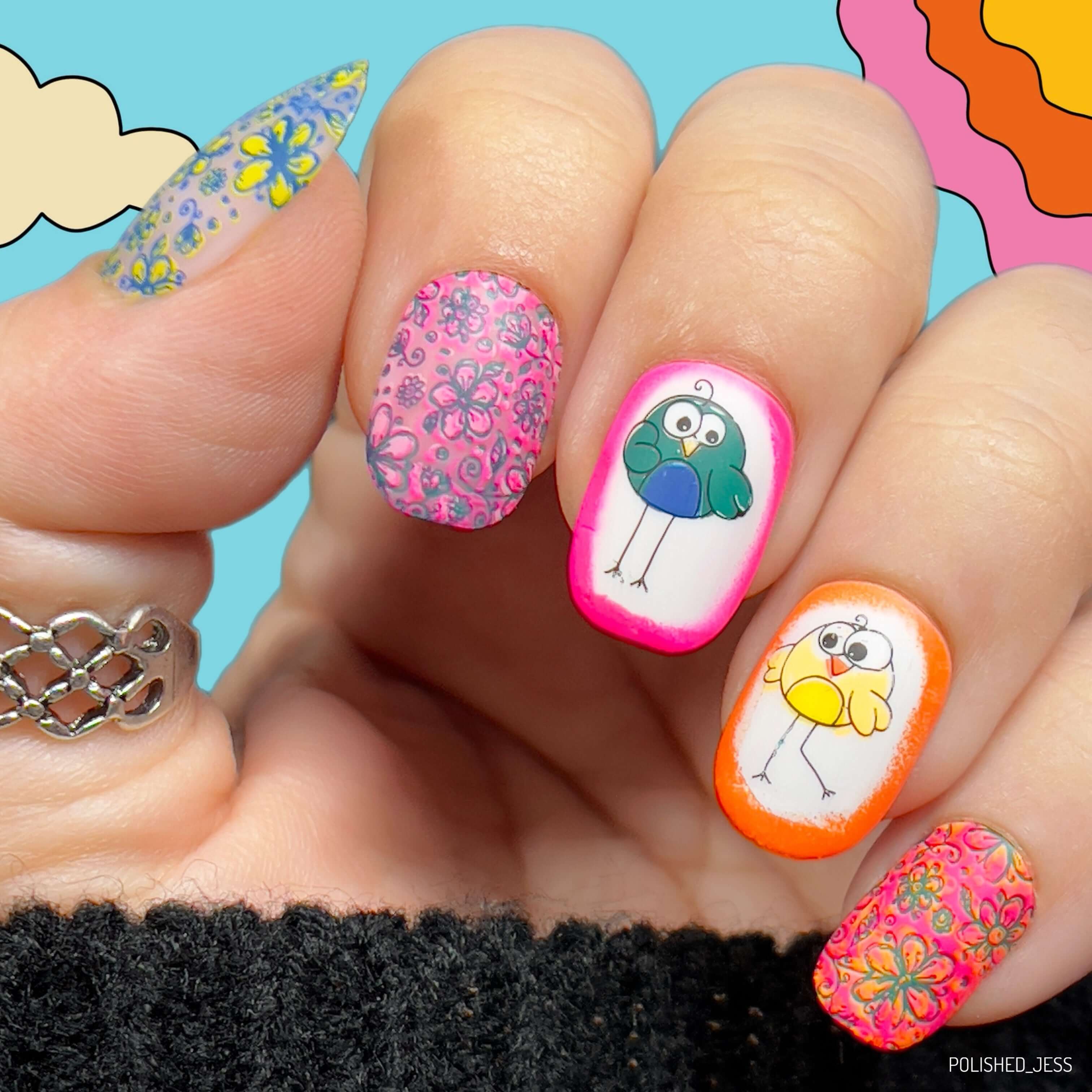 bright-bold-manicure-with-cute-nail-art-designs-of-cartoon-birds-and-floral-patterns
