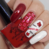 Red-manicure-showing-full-coverage-nail-art-designs-of-canadian-maple-leaves-happy-canada-day-eh