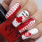 manicure-showing-nail-art-designs-in-red-and-white-of-maple-leaves-canada-flag-and-nail-art-words