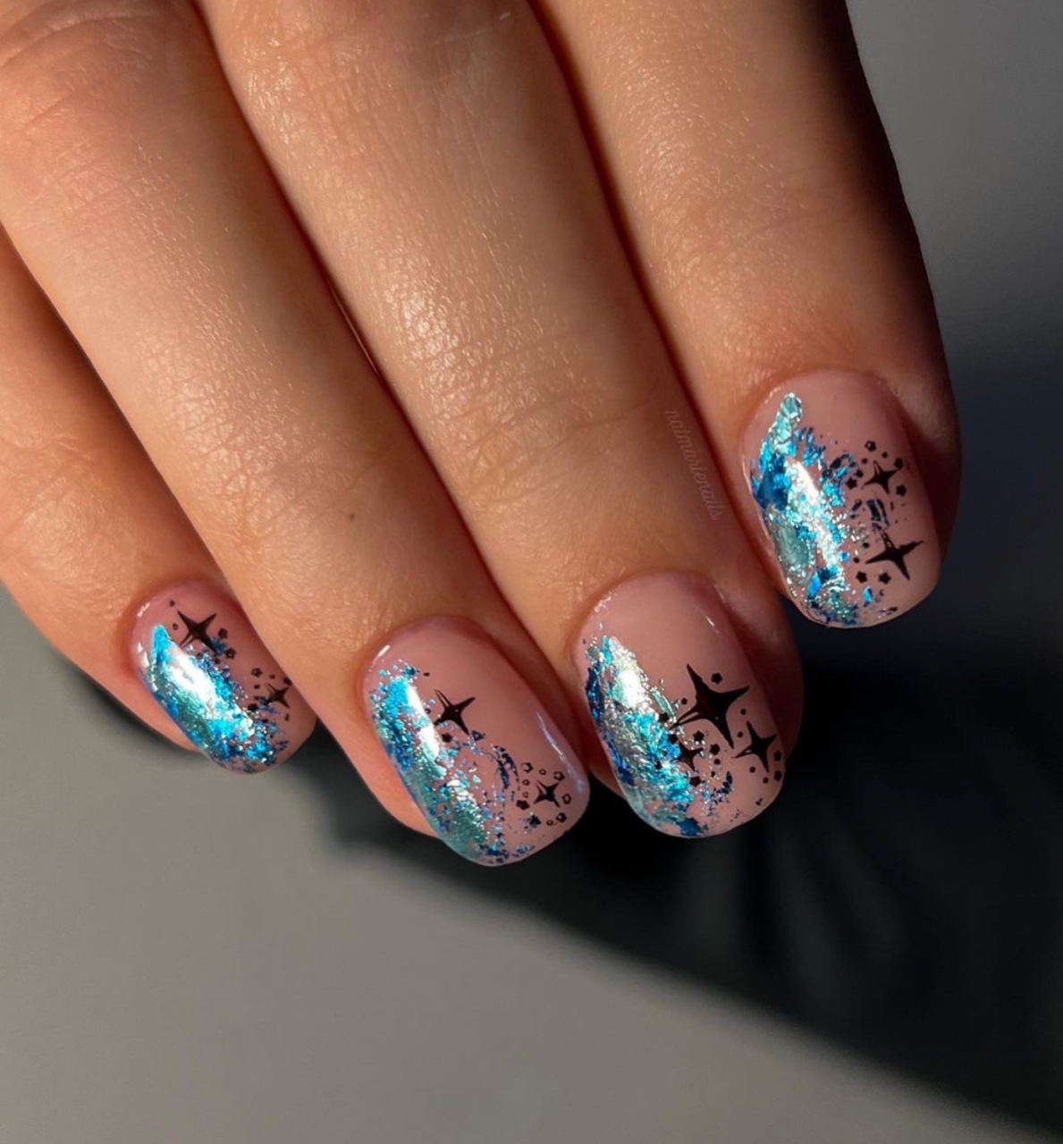 shimmery-manicure-with-star-nail-art-designs