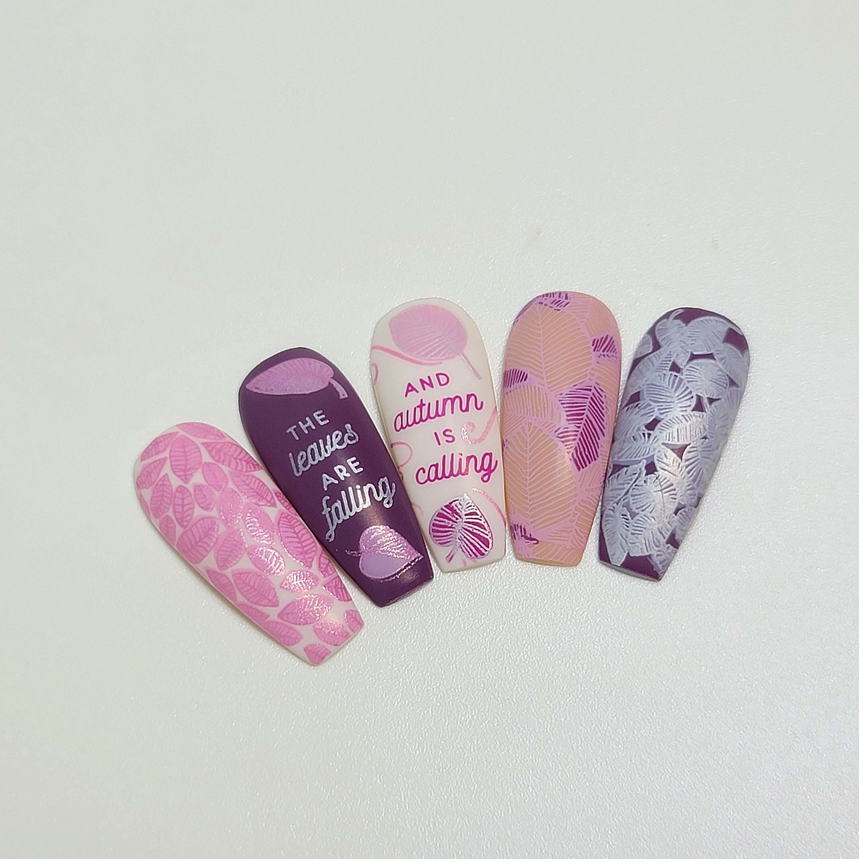 set-of-nail-tips-showing-stunning-layered-nail-art-designs-of-full-coverage-leaves-and-words-leaves-are-falling-autumn-is-calling
