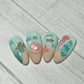 stunning-set-of-nail-tips-with-nail-art-designs-of-fish-starfish-jellyfish-and-the-words-you-me-and-the-sea