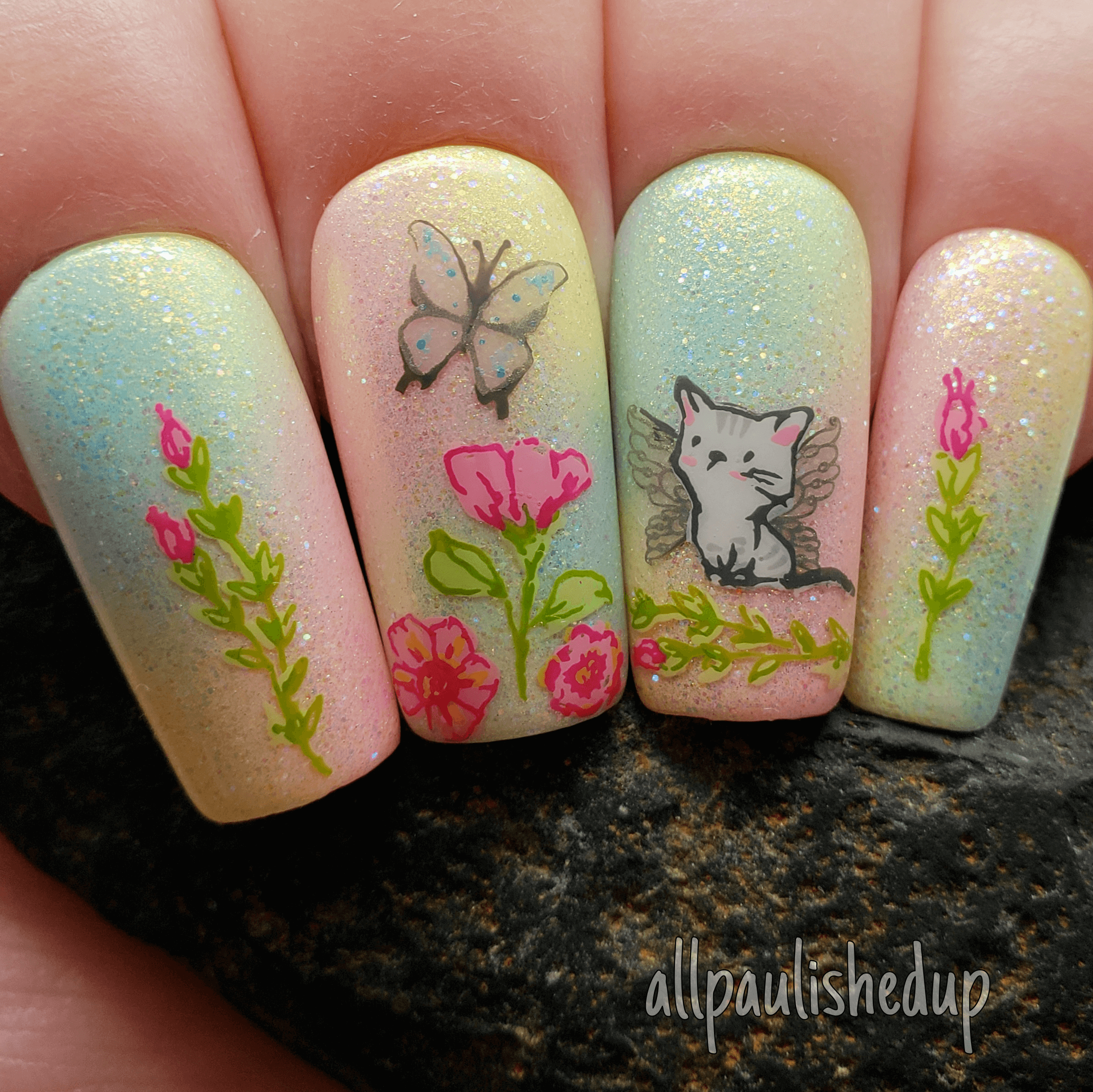 Gorgeous-manicure-showing-nail-art-designs-of-a-cute-kitten-with-wings-and-flowers
