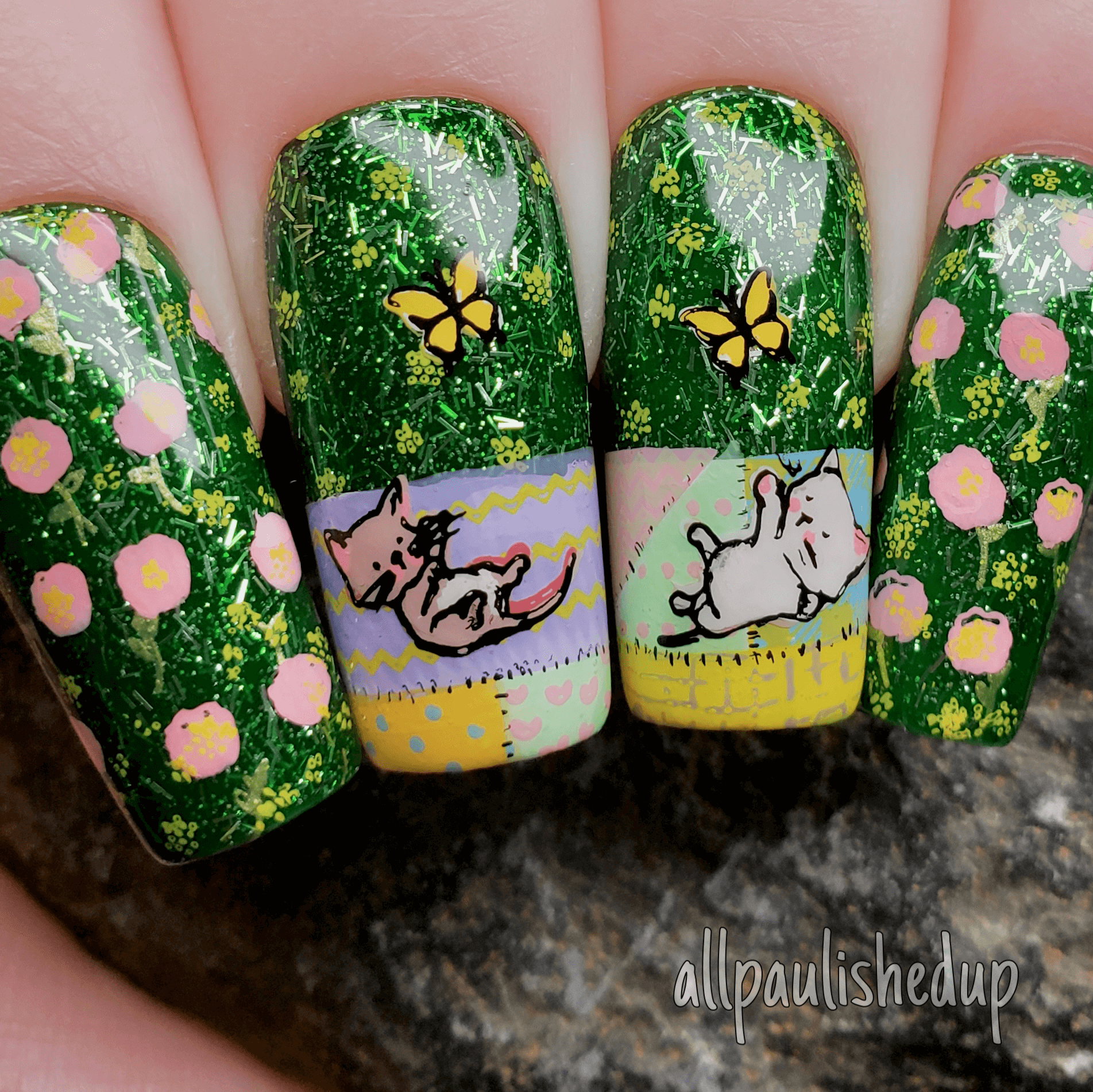 beautiful-manicure-showing-nail-art-designs-of-kittens-and-butterflies