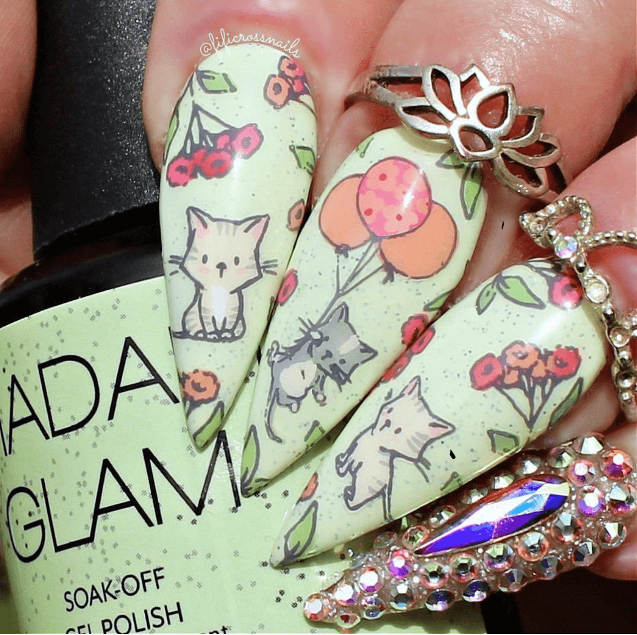 manicure-showing-nail-art-designs-of-kittens-with-balloons-and-flowers