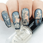 beautiful-manicure-showing-nail-art-designs-of-fairies-on-mushrooms-and-flowers