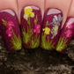 shimmery-manicure-showing-nail-art-designs-of-fairies-in-the-grass-with-flowers