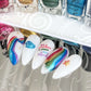 Nail-tips-showing-beautfiul-shimmery-nail-art-designs-of-rainbows-and-stars