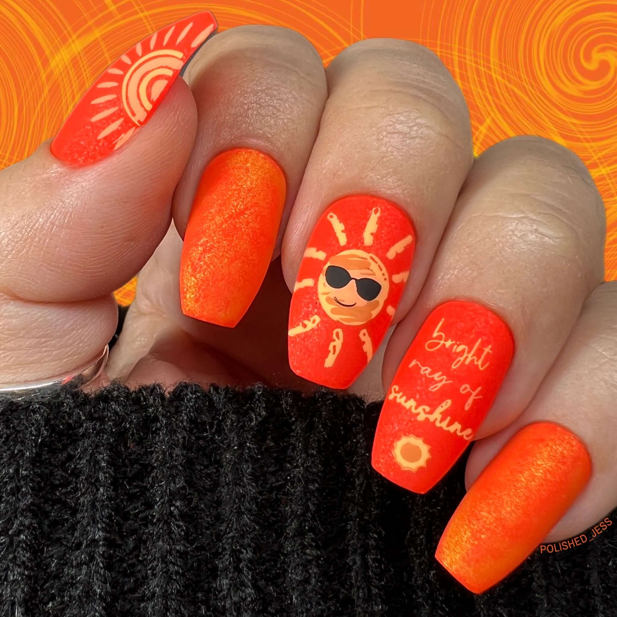 bright-orange-manicure-showing-a-nail-art-design-of-a-sunshine-with-sunglasses-and-words-bright-ray-of-sunshine