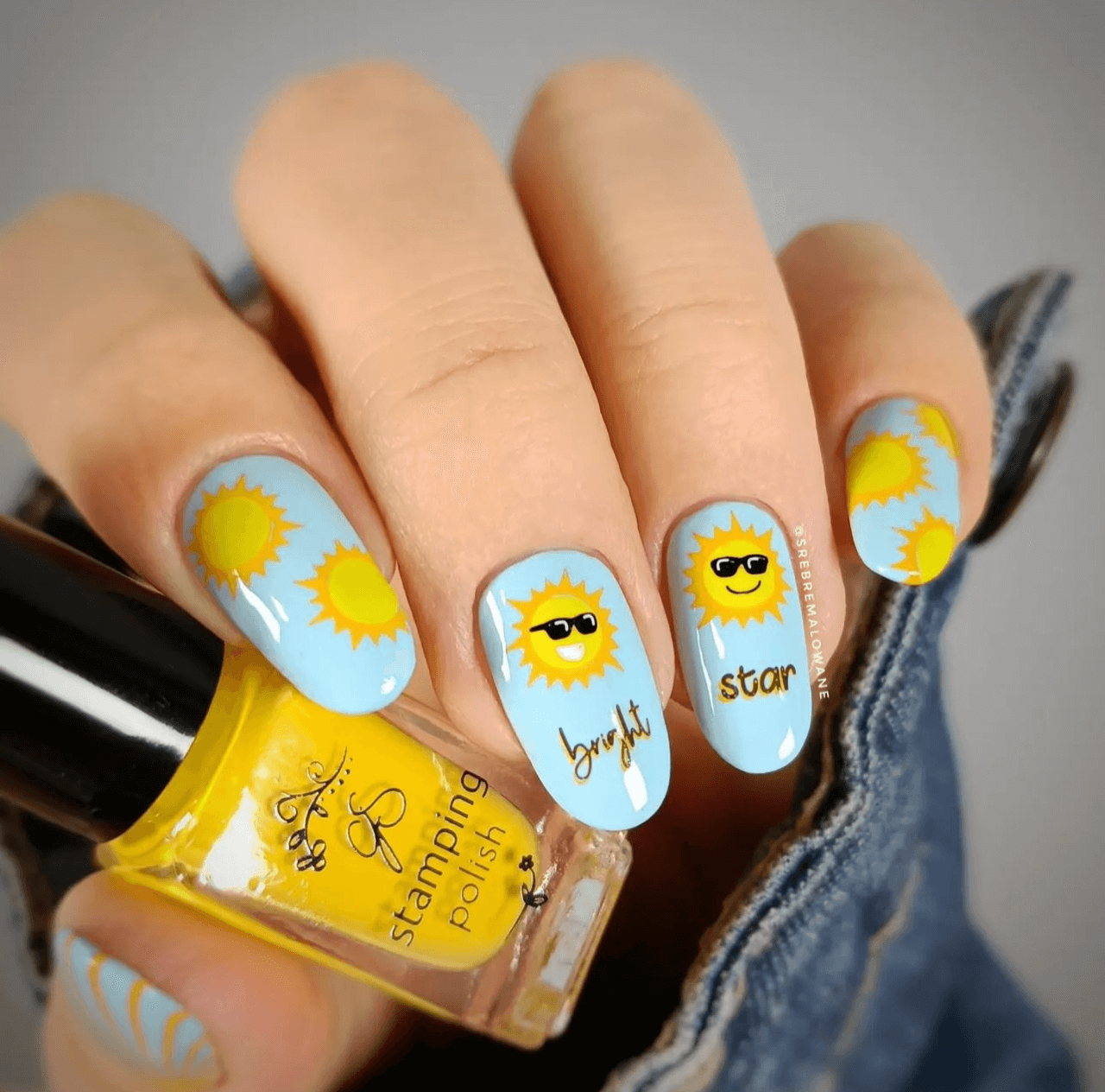 beautiful-manicure-showing-nail-art-designs-of-suns-and-the-words-of-bright-star