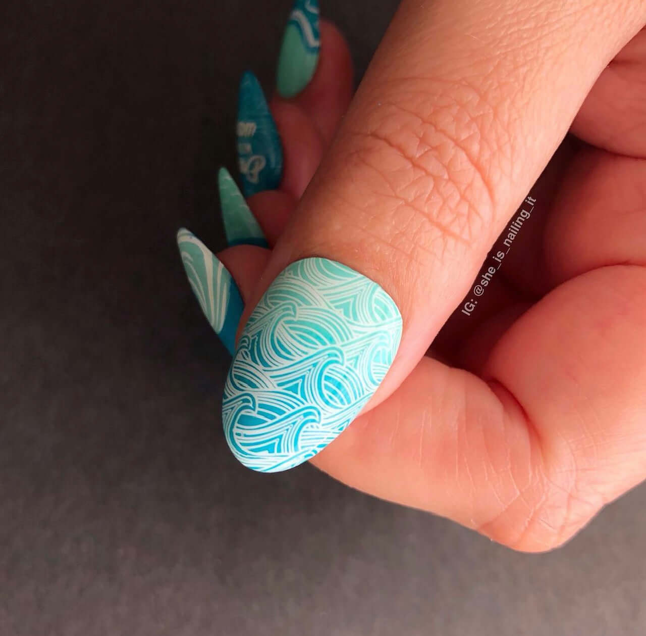 single-manicured-nail-with-stamping-nail-art-full-coverage-designs-of-waves