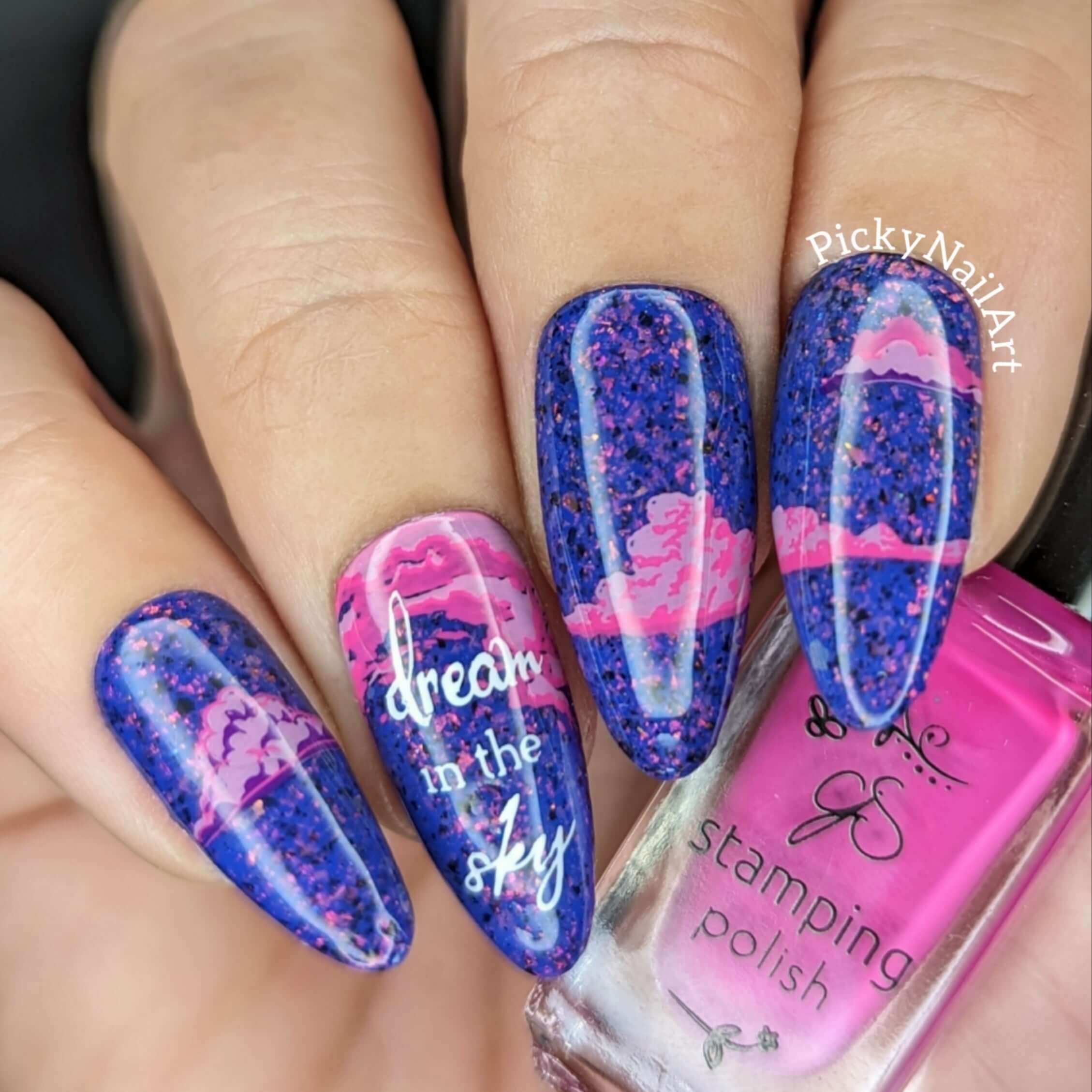 bright-manicure-showing-nail-art-designs-of-clouds-with-the-words-dream-in-the-sky