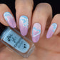 dreamy-manicure-showing-nail-art-designs-of-clouds-and-a-heart-cloud-with-a-bottle-of-clear-jelly-stamper-polish