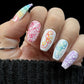 beautiful-manicured-hand-showing-nail-art-of-colorful-twirls-and-swirls
