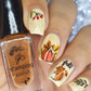 manicure-showing-autumn-nail-art-designs-of-a-squirrel-pumpkin-and-leaves-