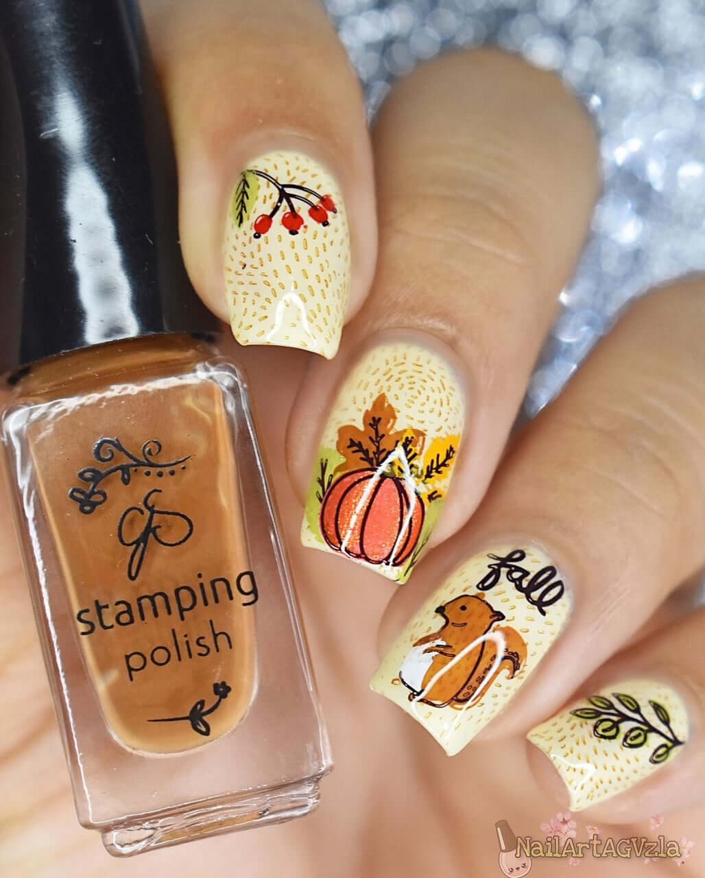 manicure-showing-autumn-nail-art-designs-of-a-squirrel-pumpkin-and-leaves-