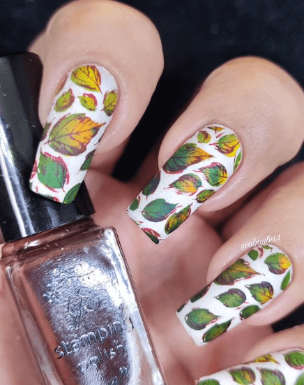 white-manicure-showing-full-coverage-nail-art-designs-of-leaves