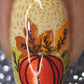 single-manicure-nail-showing-nail-art-design-of-a-pumpkin-with-leaves
