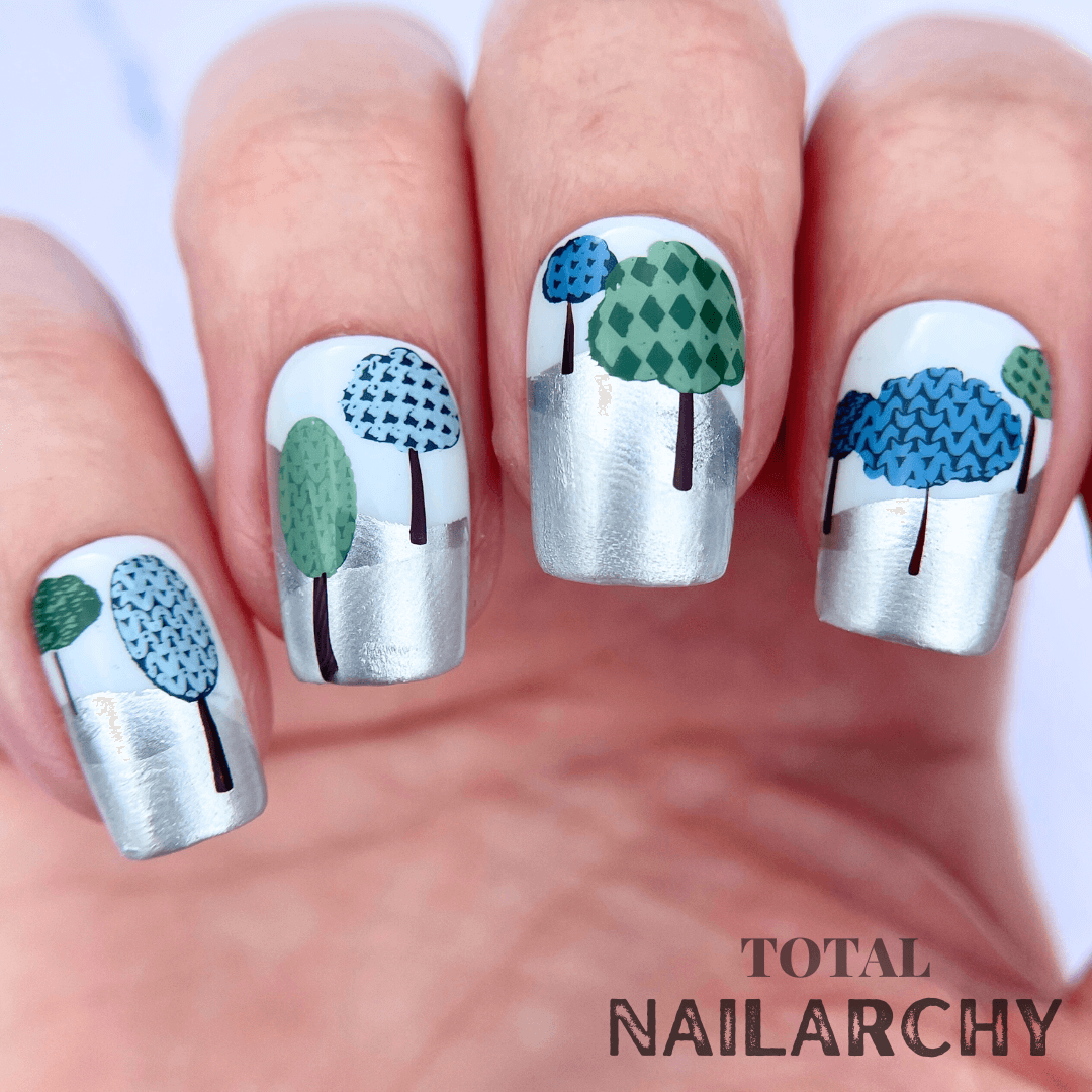 beautiful-manicure-showing-nail-art-of-patterned-winter-trees