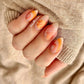 Nude-manicure-showing-nail-art-designs-of-modern-boho-shapes-and-leaves