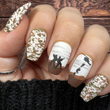 Manicure-showing-military-themed-nail art-designs-of-soldiers-and-a-helicopter-with-camo-print