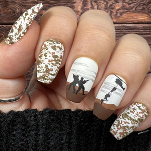 Manicure-showing-military-themed-nail art-designs-of-soldiers-and-a-helicopter-with-camo-print