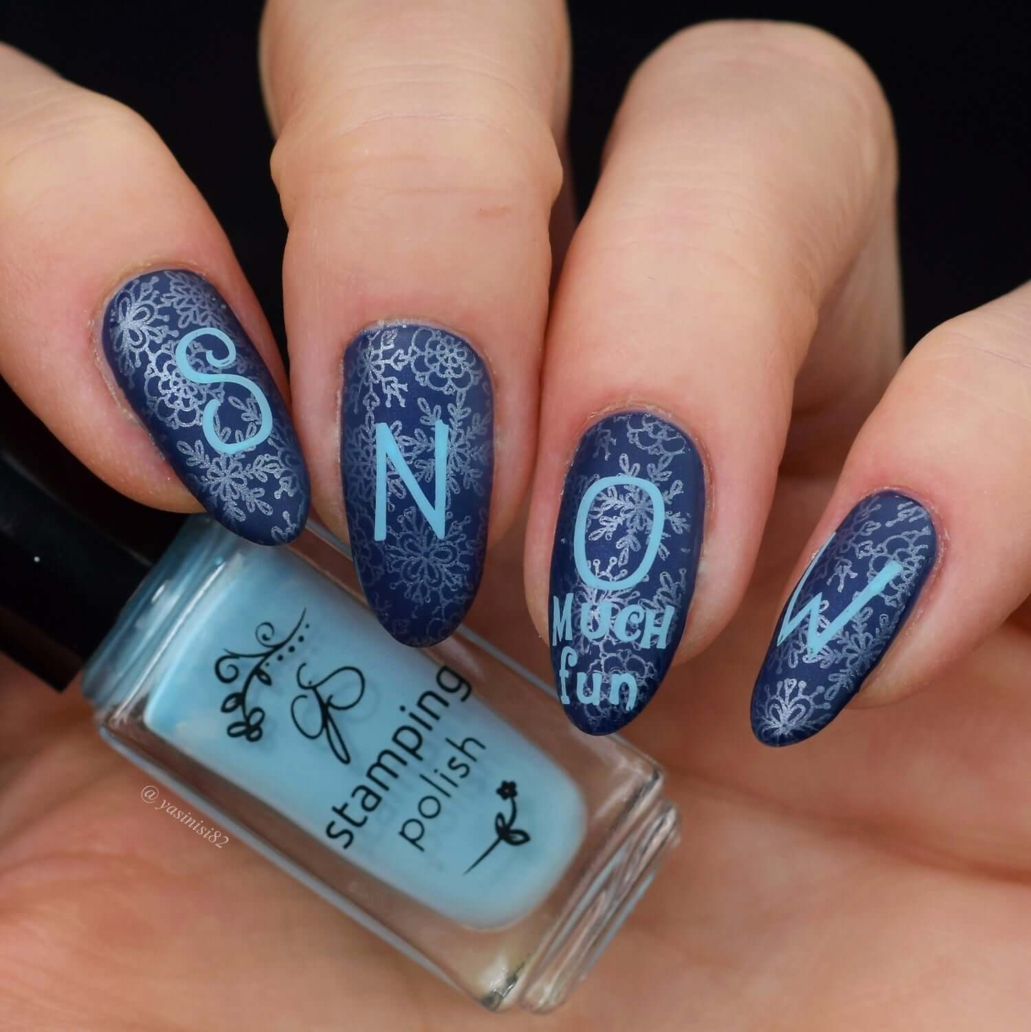 Beautiful-manicure-with-a-nail-art-design-of-snowflakes-and-words-saying-snow-much-fun