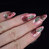 manicure-showing-beautiful-nail-art-roses-and-leaves-on-a-base-of-pink-glitter-nail-polish