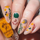 Manicure-showing-nail-art-designs-of-modern-boho-shapes-and-leaves