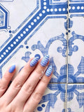 White-and-blue-manicure-showing-beautfiul-baroque-full-coverage-pattern-with-matching-ceramic-tile