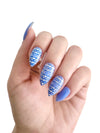 White-and-blue-nail-art-manicure-showing-beautfiul-baroque-full-coverage-pattern